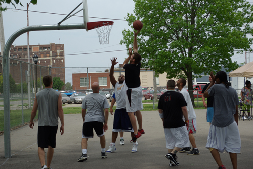 Group of deputies playing basketball outside for charity