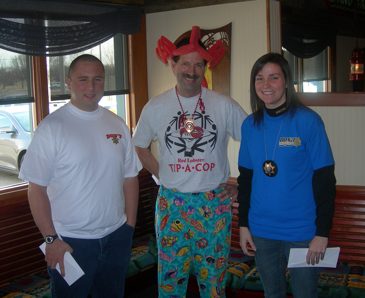 Three people pose for a photo together at Red Lobster