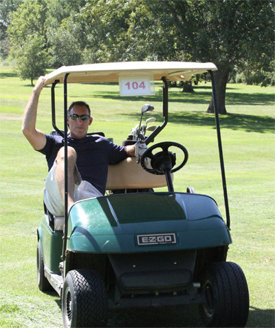 Deputy J. Podhaski sits in a golf cart