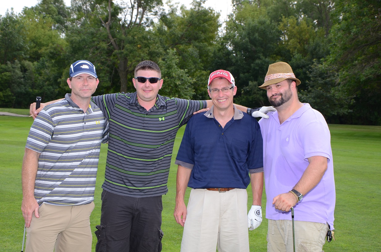 Group of golfers linking arms for a photo together