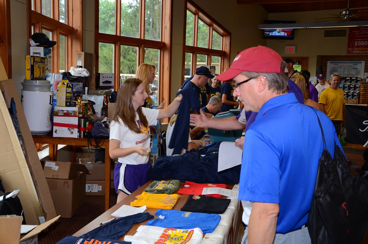 People buying merchandise at the counter