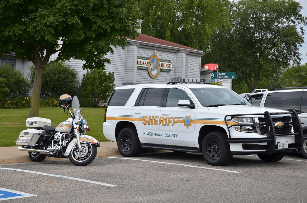Sheriff's office motorcycle and car