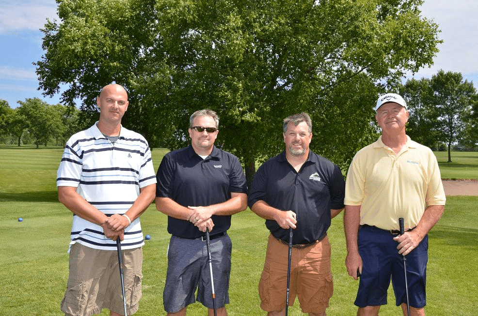 Group of golfers posing for a picture together