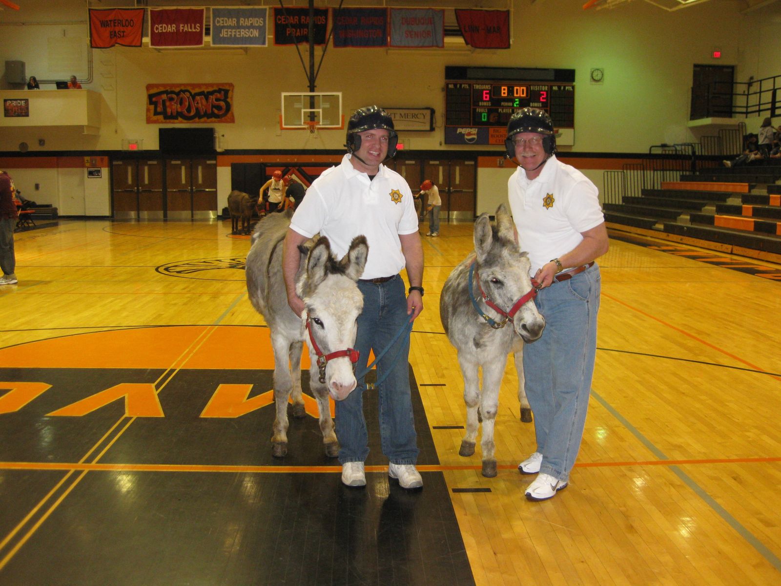 Sheriff and deputy pose with donkeys