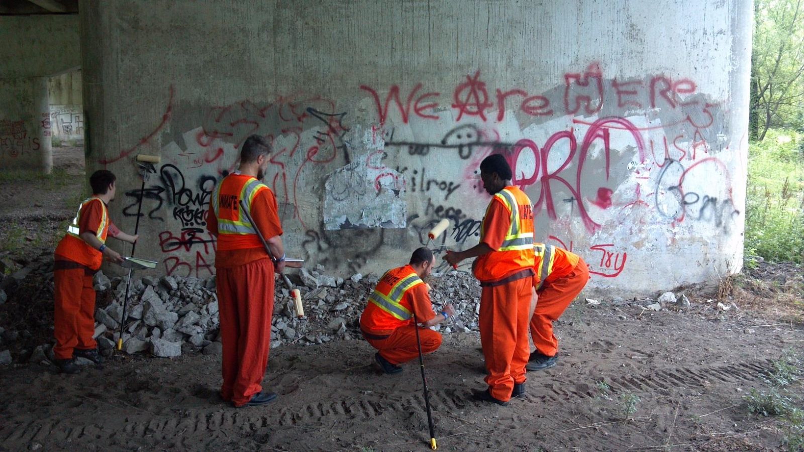 A group of inmates cleaning up the bike trail