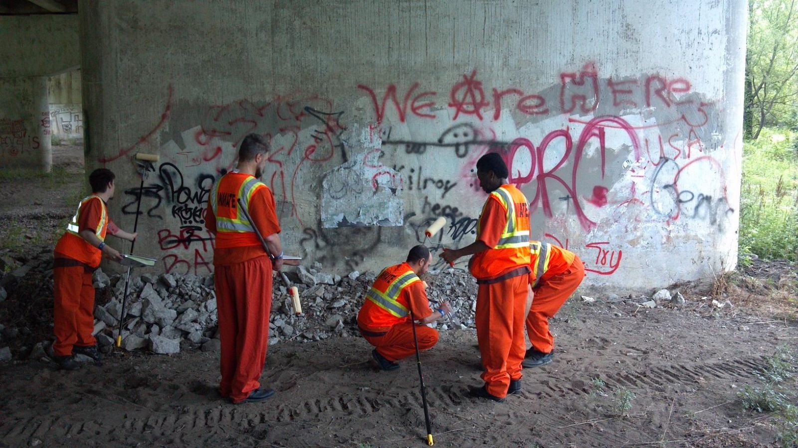 A group of inmates cleaning up the bike trail