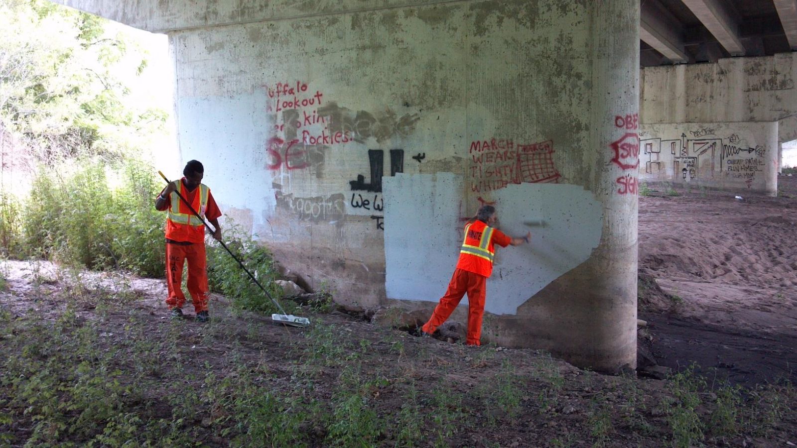 Inmates cleaning up the bike trail