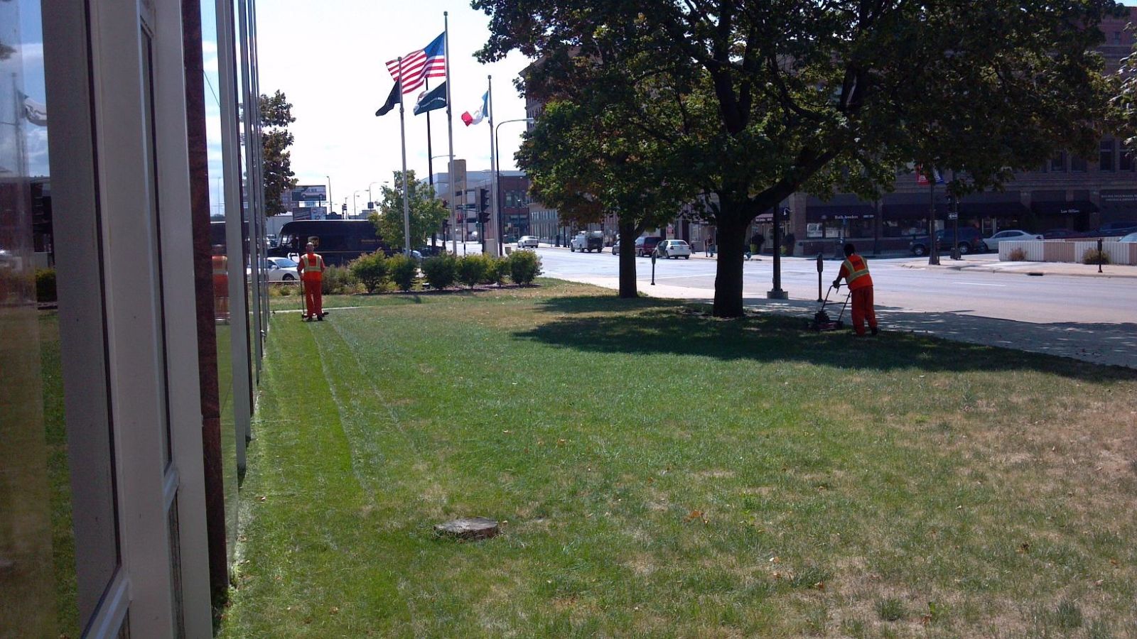 Courthouse lawn being mowed by inmates