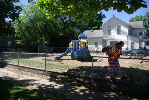 An inmate cleaning up the park