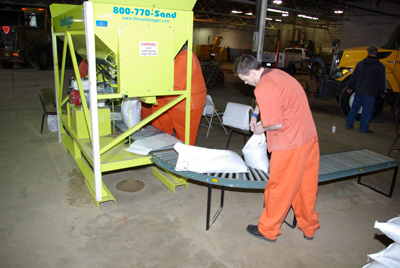 Inmates helping prevent floods with sandbags