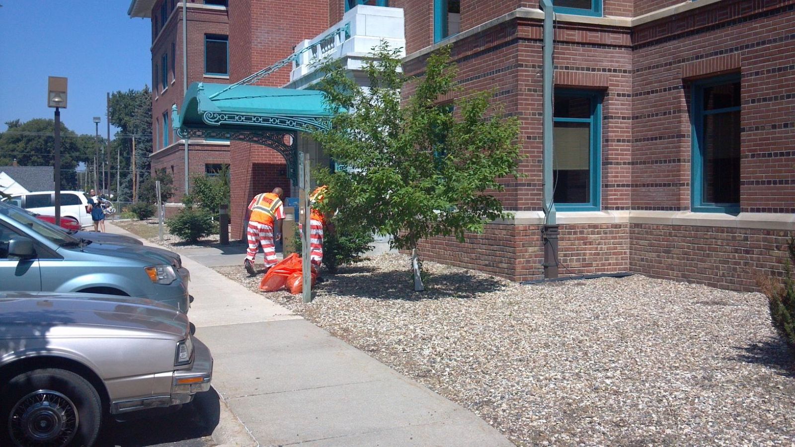 Inmates working together to clean up and maintain landscaping