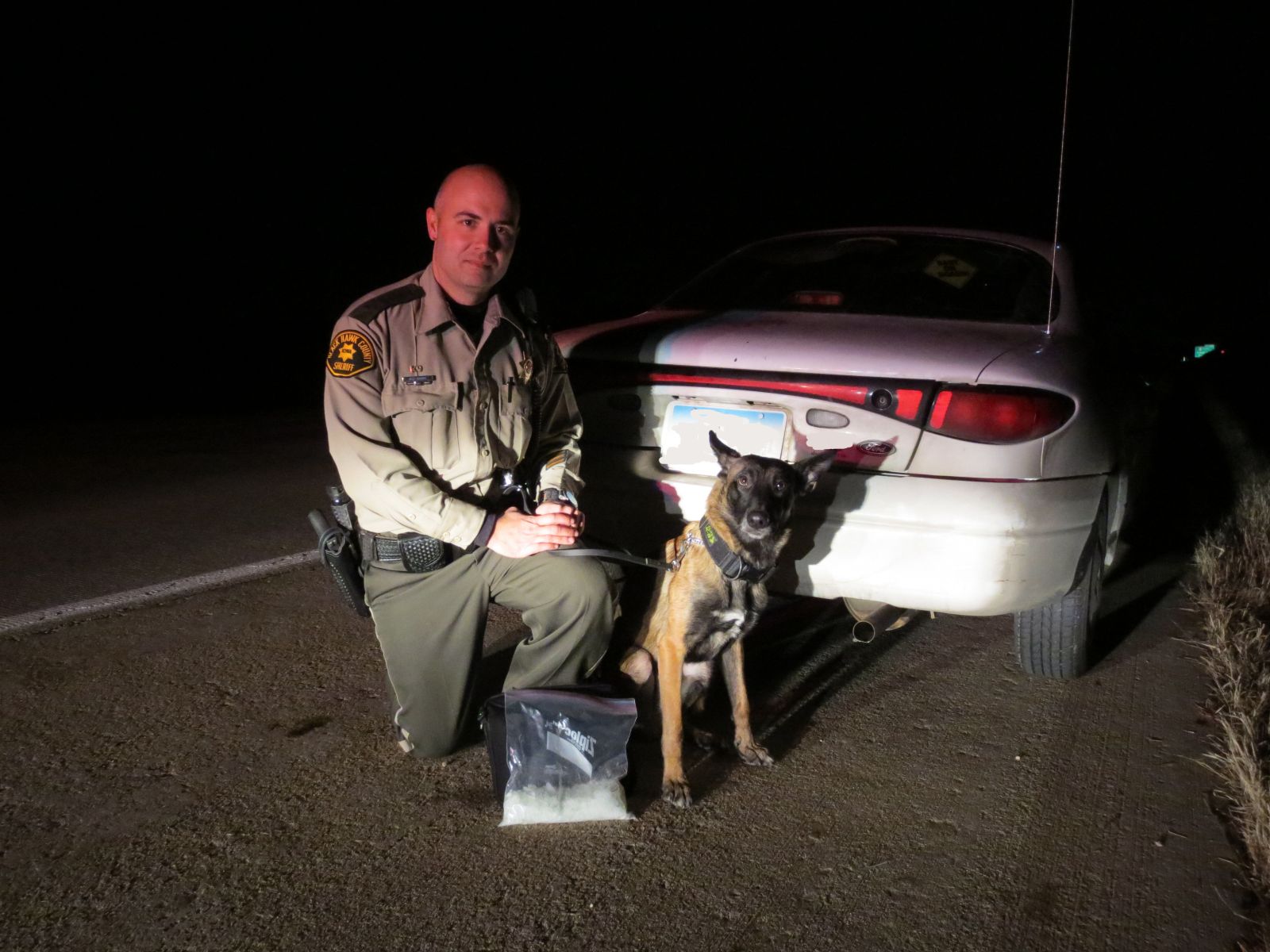 Image of Deputy Harris and Loki at a bust