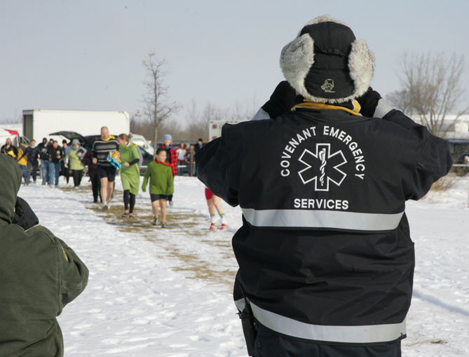 Group of people walking toward the water for the polar plunge