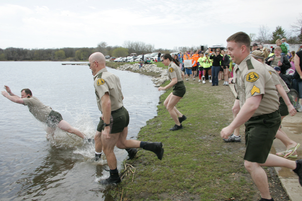 Deputies going into the water during a Polar Plunge event