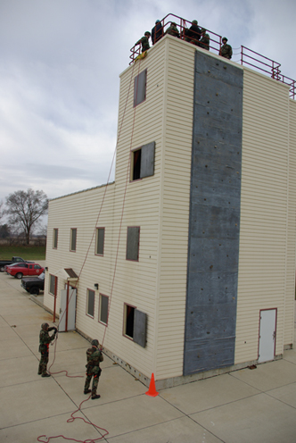 Sheriffs rappelling on side of building