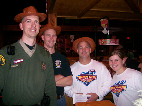 Group of law enforcement officials posing for a picture at Texas Roadhouse