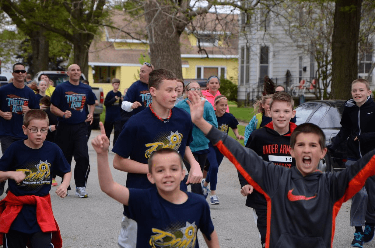 Image of group of people running in the Torch Run event