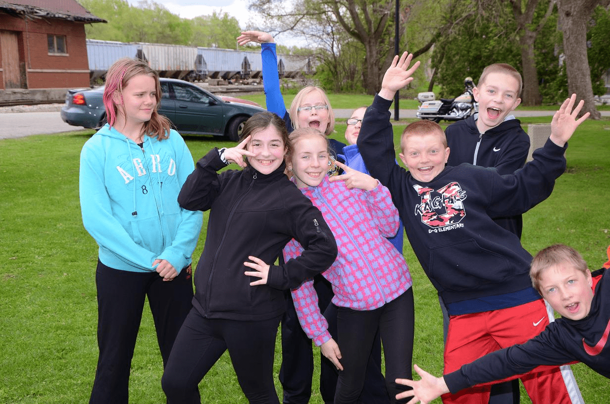 Image of kids group photo at the Torch Run event